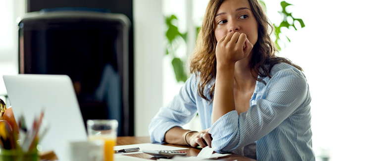 A woman feeling financial stress.