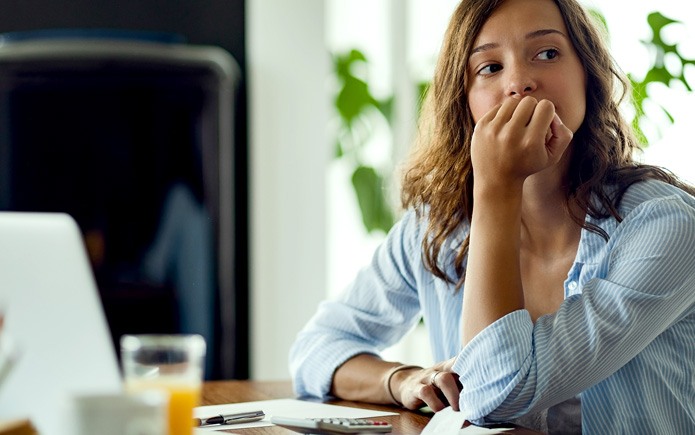 A woman feeling financial stress. 