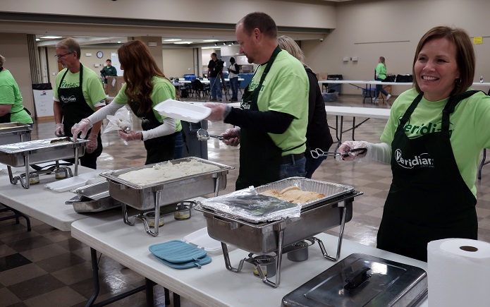 Veridian employees preparing free Thanksgiving dinner to go.