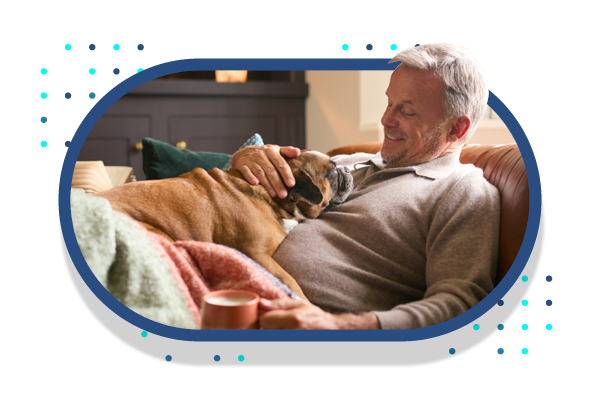 Couple Looking at Computer Holding Paper Bills