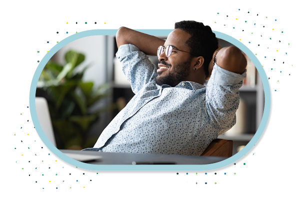 Man relaxing at computer after checking his accounts online.