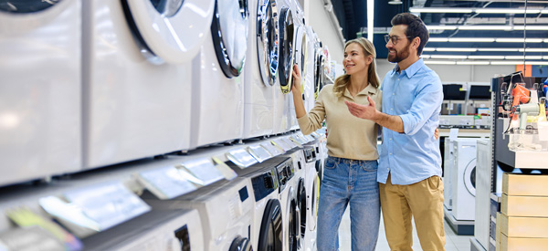 Couple shopping for washing machine